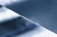 Why do stainless steel rolls use pad paper?